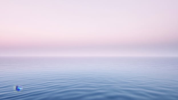 A blue ball floating in the ocean at sunset photo