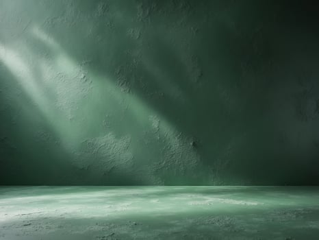 Green wall with light coming through it photo