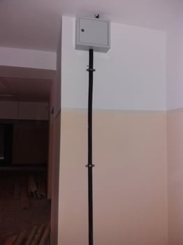 Electrical installation revealed within a newly renovated indoor space during construction work photo