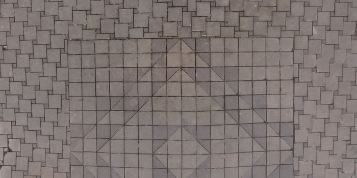 A large square tile pattern on the ground photo