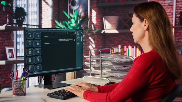 Woman typing prompts into AI powered chat system on computer, advanced virtual assistant showcases futuristic algorithms and smart solutions for productivity and connectivity. Camera B. photo