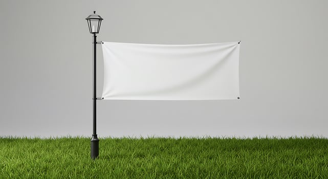 Blank White Banner on Street Light Post Standing on Green Lawn photo