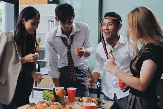 Group of people eating food at a table photo