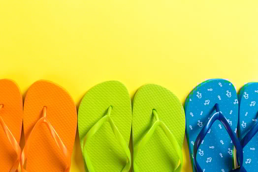 a lot flip flop colored sandals, summer vacation on colored background, copy space photo