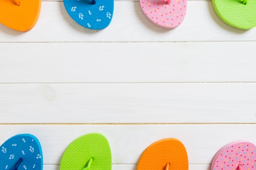 lot flip flop colored sandals, summer vacation wooden background, copy space top view photo