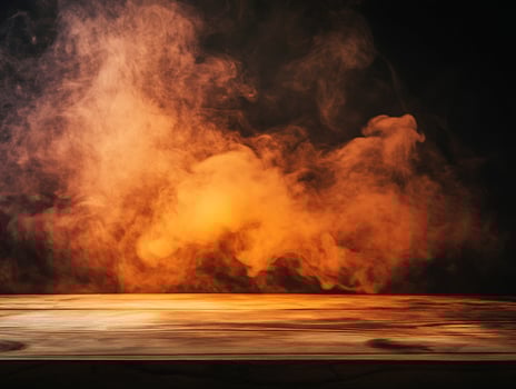 Wooden Table with Orange Smoke Background photo