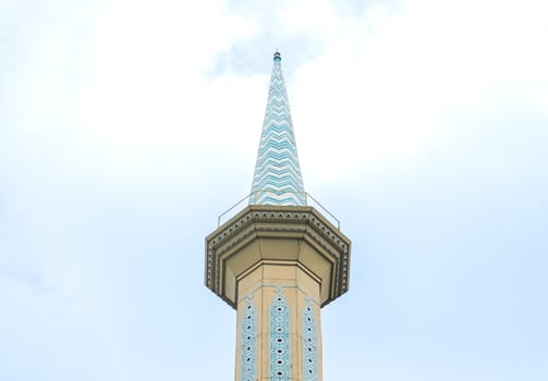 Minaret of a mosque in blue skies. After edits. photo
