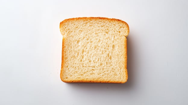 Freshly sliced white bread slice isolated on a clean background photo