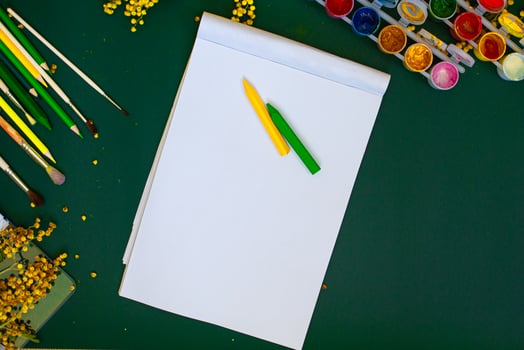 watercolor blank paper and colored pencils photo