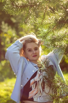 Atmospheric portrait of a young woman with blond hair. Caucasian mixed race female model in summer dress photo
