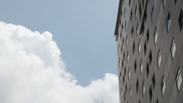 Abstract image of looking up at modern glass and concrete building photo