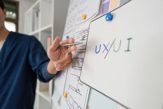 UXUI Focus and Professional Detailing. Team member highlights key design principles. photo
