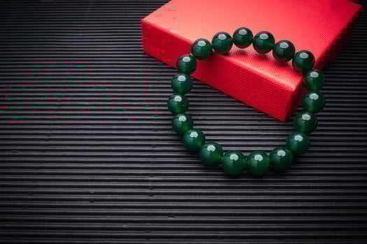 Close-up of Jade bangle or bracelet on a black background. photo