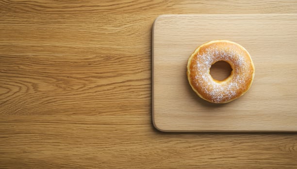 Delicious Glazed Donut on Wooden Board Copyspace Background Food Photography Minimalist Viewpoint photo