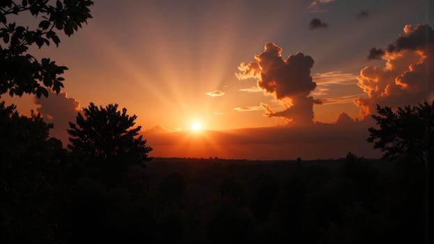 Majestic Sunset with Rays and Clouds over a Serene Landscape photo