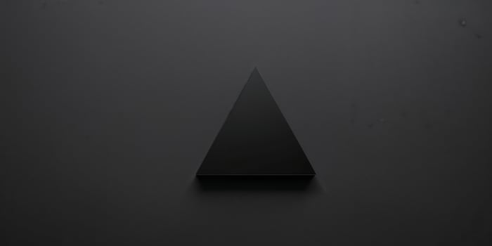 A black background with a black triangle on it. photo