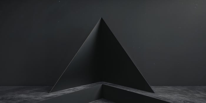 A black triangle with a dark floor and a wall photo