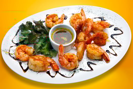 Haute cuisine, large shrimp with sauce. photo