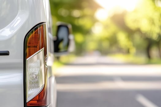 A white van is parked on the road photo