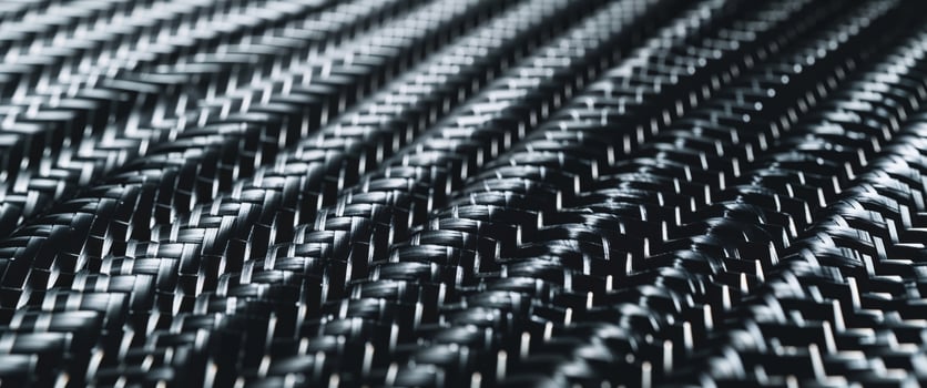 Modern woven carbon fiber texture background for design projects photo