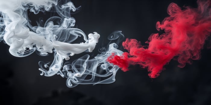 Two red and white smoke on a black background photo
