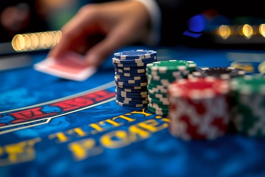 Croupier dealing cards on casino table with poker chips photo