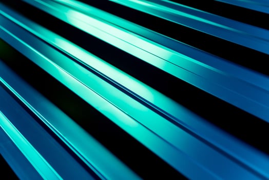 Green metallic roof tiles background with light pattern. photo