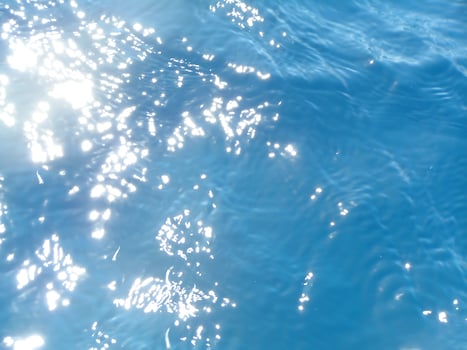 Clean background with transparent sea water in turquoise and blue tones, imitating the natural texture of the ocean photo
