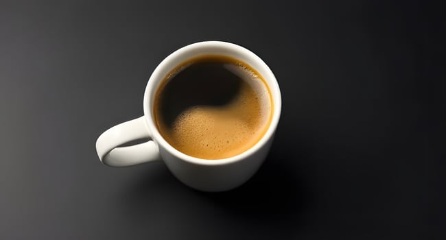 A cup of coffee on a black background photo