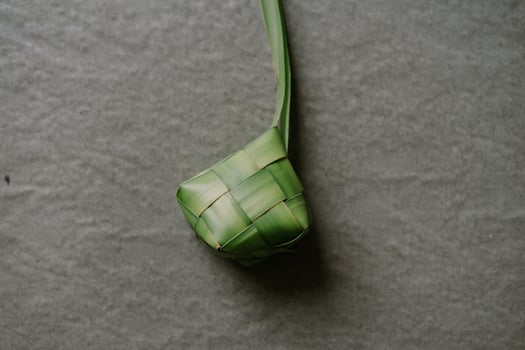 Ketupat Diamond Shaped Rice Cake Wrapped with Woven Young Coconut Leaves photo