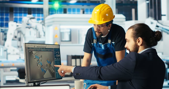 Solar panels expert sharing findings with engineer after developing new technologies harnessing sun power. Photovoltaics factory researcher telling worker how to improve efficiency, camera B photo