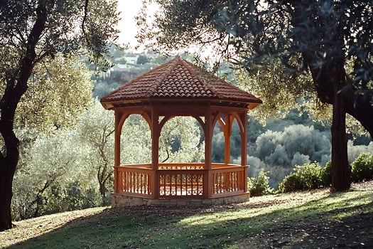 A gazebo sitting on a hillside photo