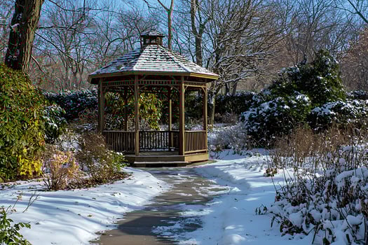 A gazebo in a snowy park photo