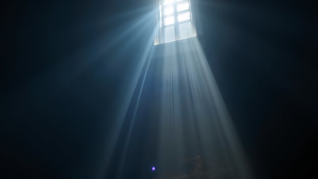 Light Beams Streaming Through Window in Dark Room with Shadows photo