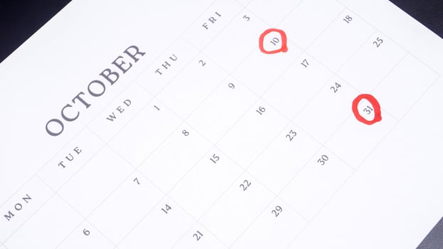 Red circle marked on a calendar at 10 and 31 of October photo
