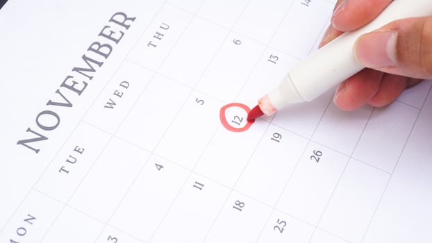 Red circle marked on a calendar at 12 of November photo