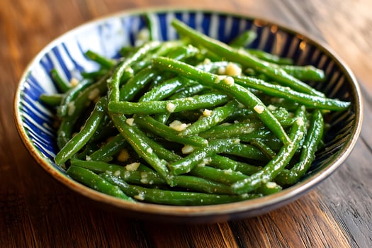A bowl of green beans with garlic and parsley photo