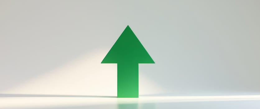 Green upward arrow pointing up representing growth and success photo