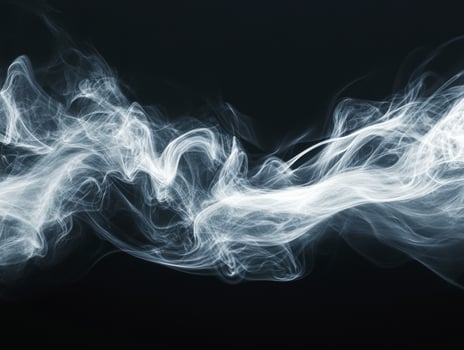 Ethereal white smoke swirling against a dark backdrop photo