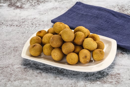A plate of kiwis on a table photo