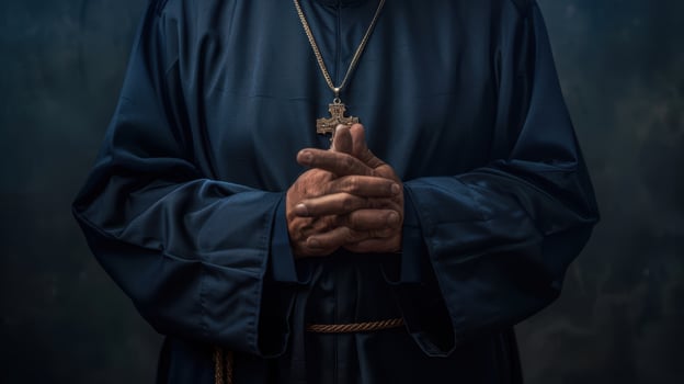 The priest's clasped hands photo