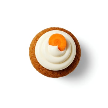 Gourmet Carrot Cake Cupcake top viewith rich swirled frosting and walnut crumbles. Perfectly presented on a white background with a subtle shadow for depth photo