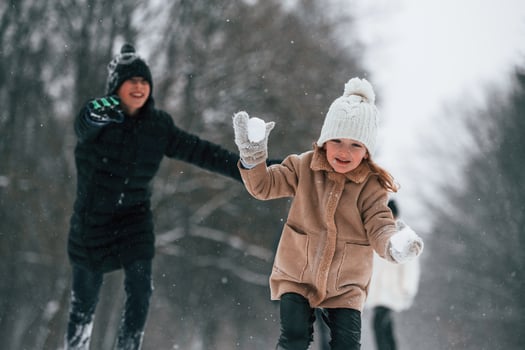 Mother and ,father is with daughter have walk outdoors at the winter season photo