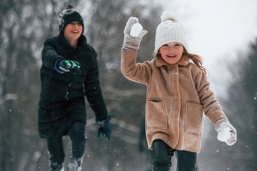 Mother,and father is with daughter have walk outdoors at the winter season photo