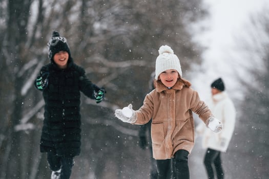 Mother ,and father is with daughter have walk outdoors at the winter season photo