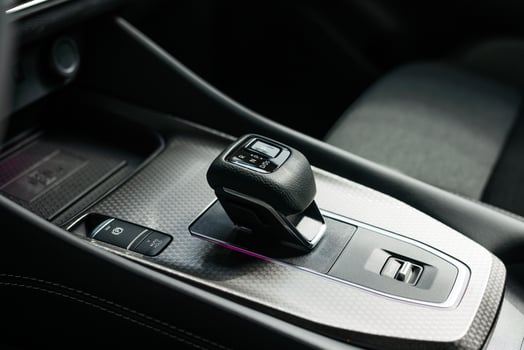 Close up car automatic transmission. Gear shift in new electric car. Selector automatic transmission with leather in the interior of a new modern car. Car Black leather interior photo