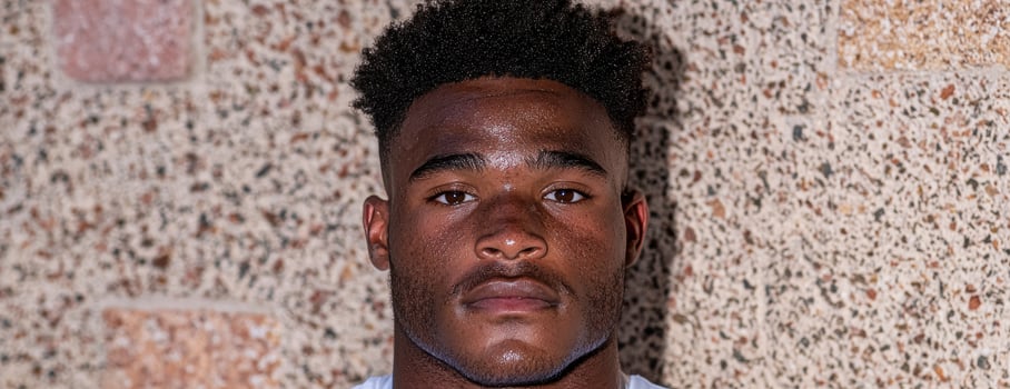 Close up portrait of a young man with athletic build photo