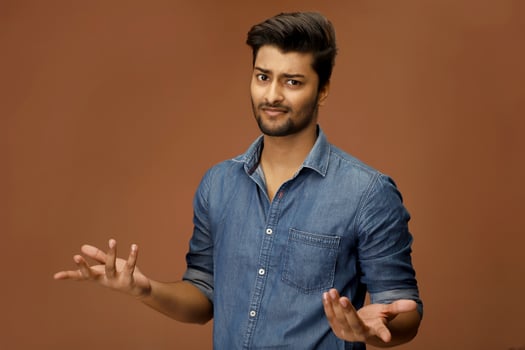 Asian model is posing with a shrug gesture. photo