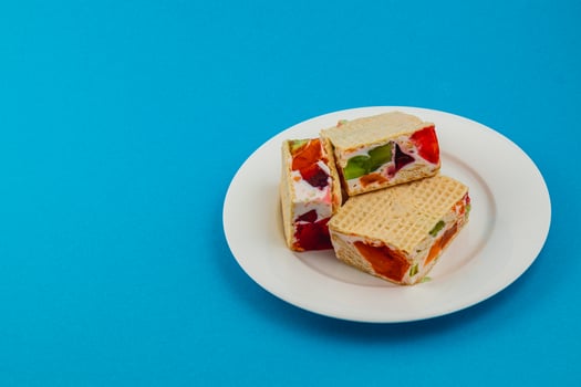 Creamy jelly waffle cakes with fruit toppings for dessert photo