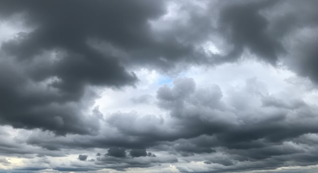 Dark storm clouds filling the sky create a dramatic, ominous weather scene. photo